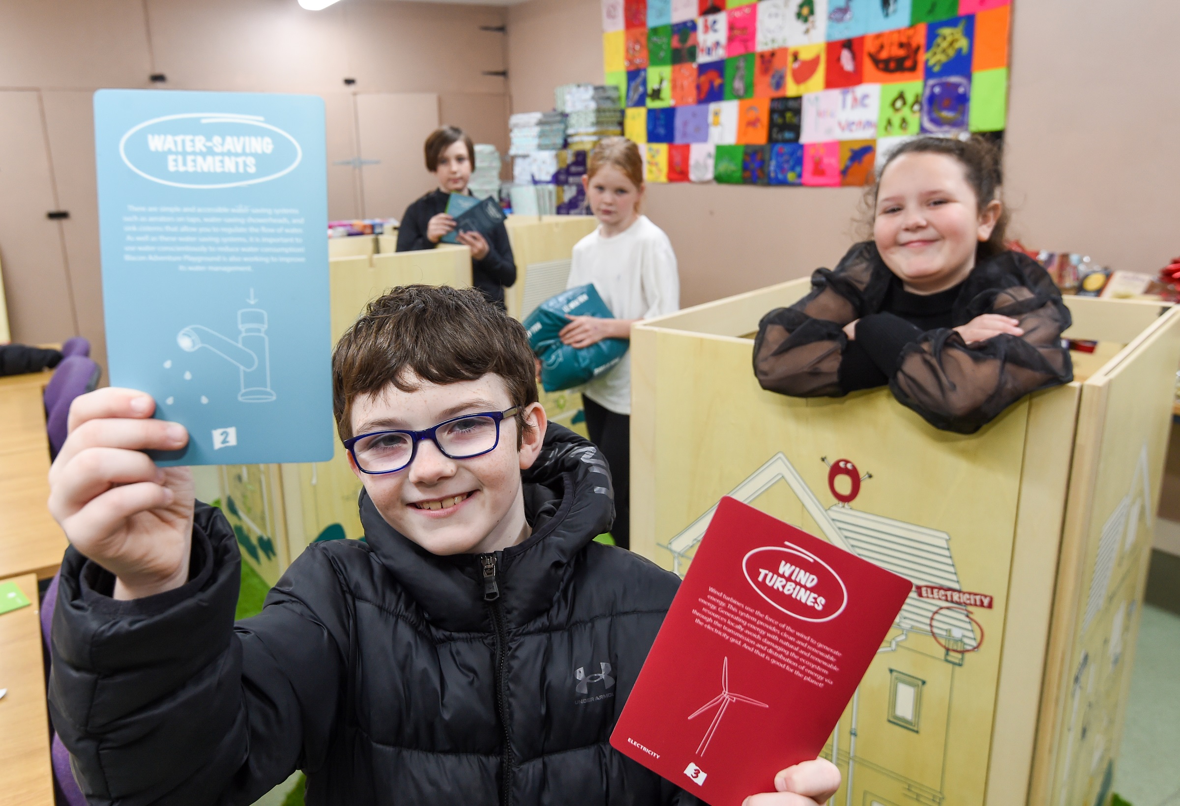 Picture showing children enjoying the new educational materials at Blacon Adventure Playground